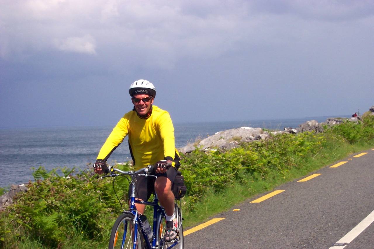 Ireland bike tour cyclist ocean view