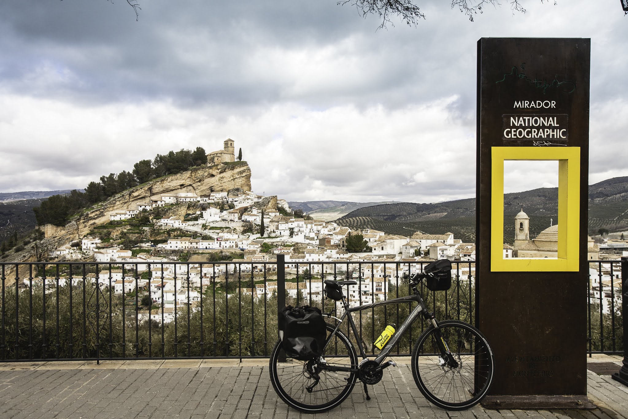 Spain village with bike and national geographic sign