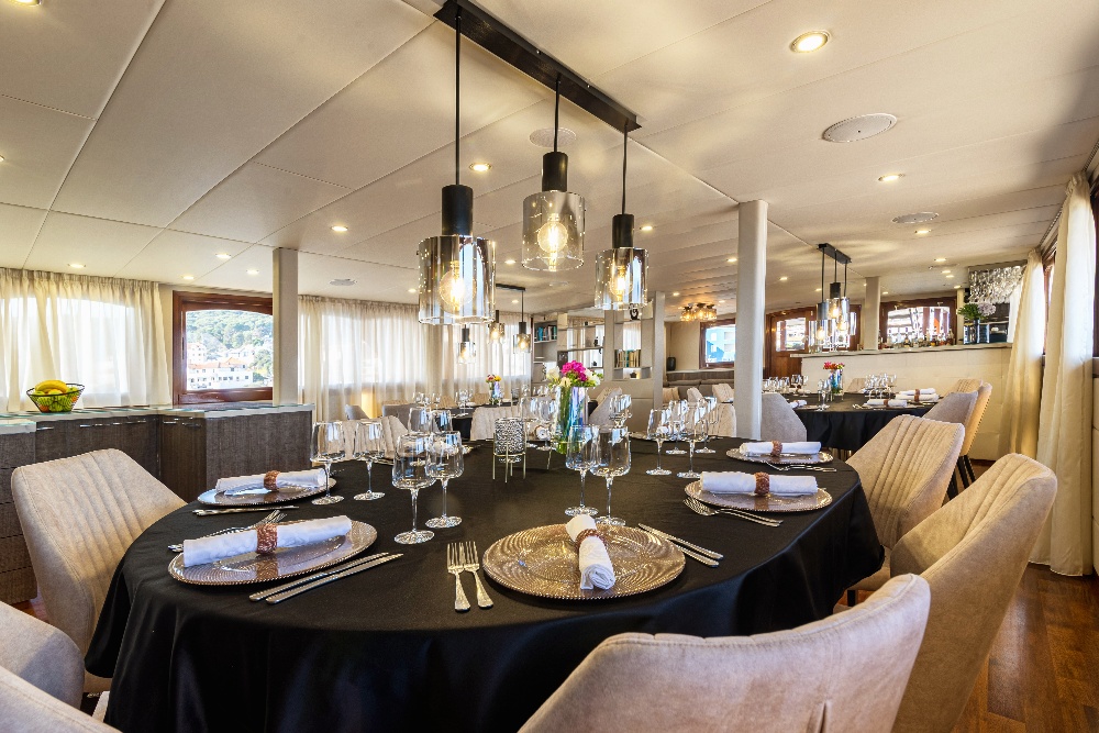 Dining table aboard melody boat