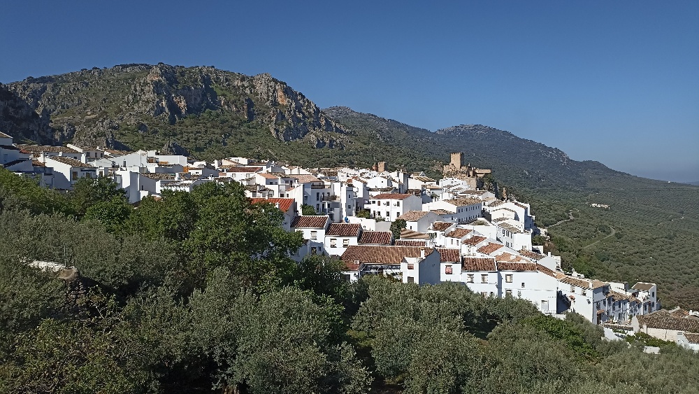 Spanish town white buildings in green mountain