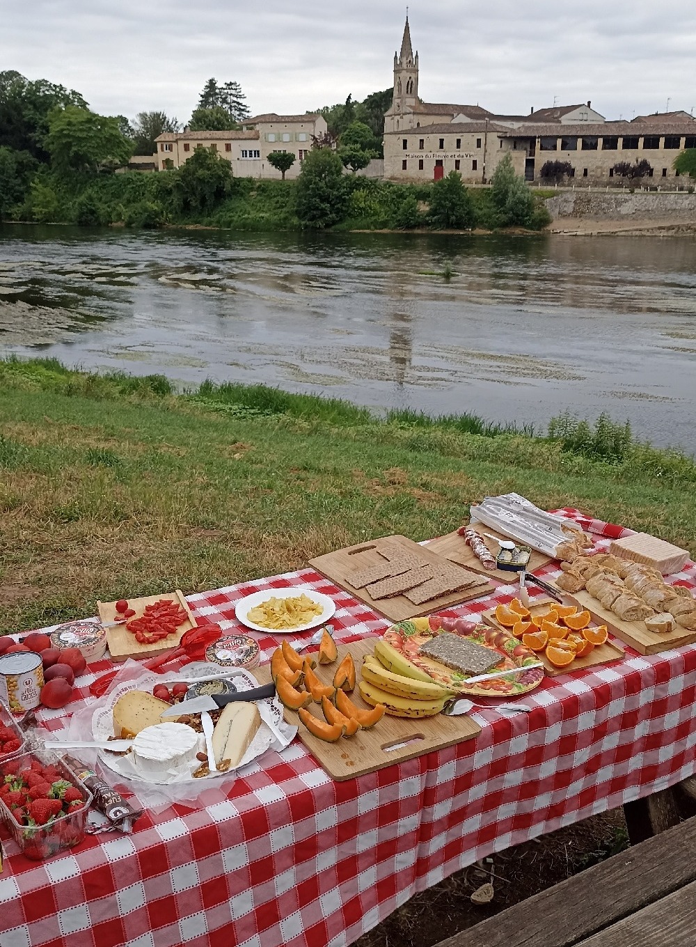 Picnic table with food next to river
