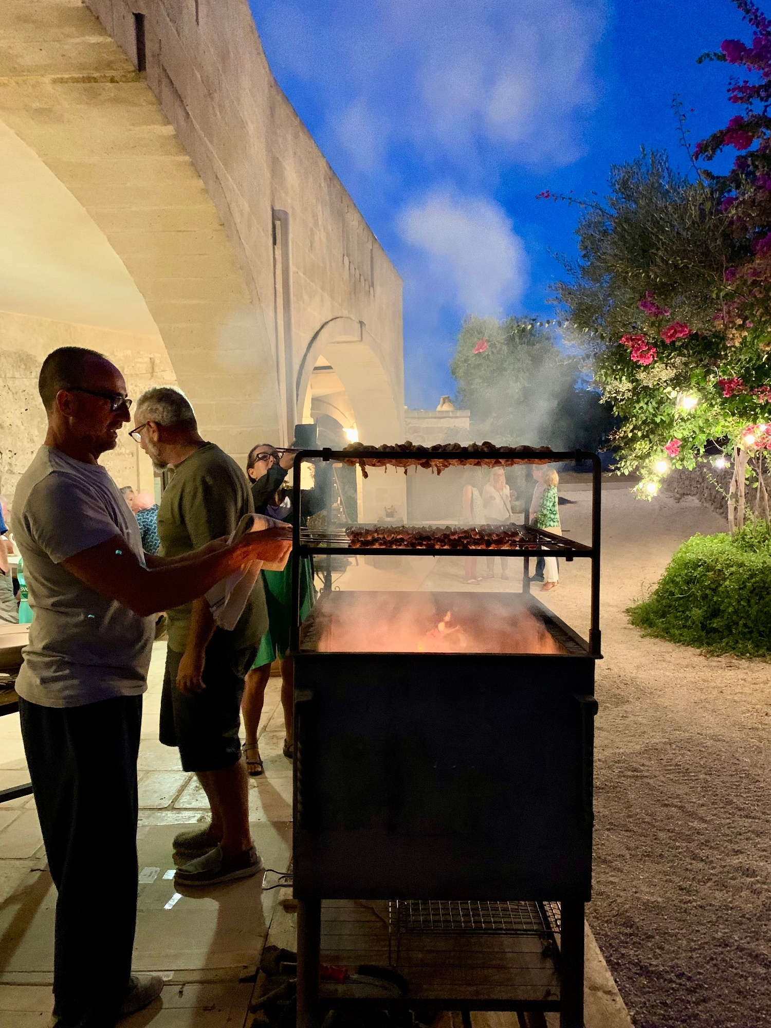 Italy's Puglia people cooking outside