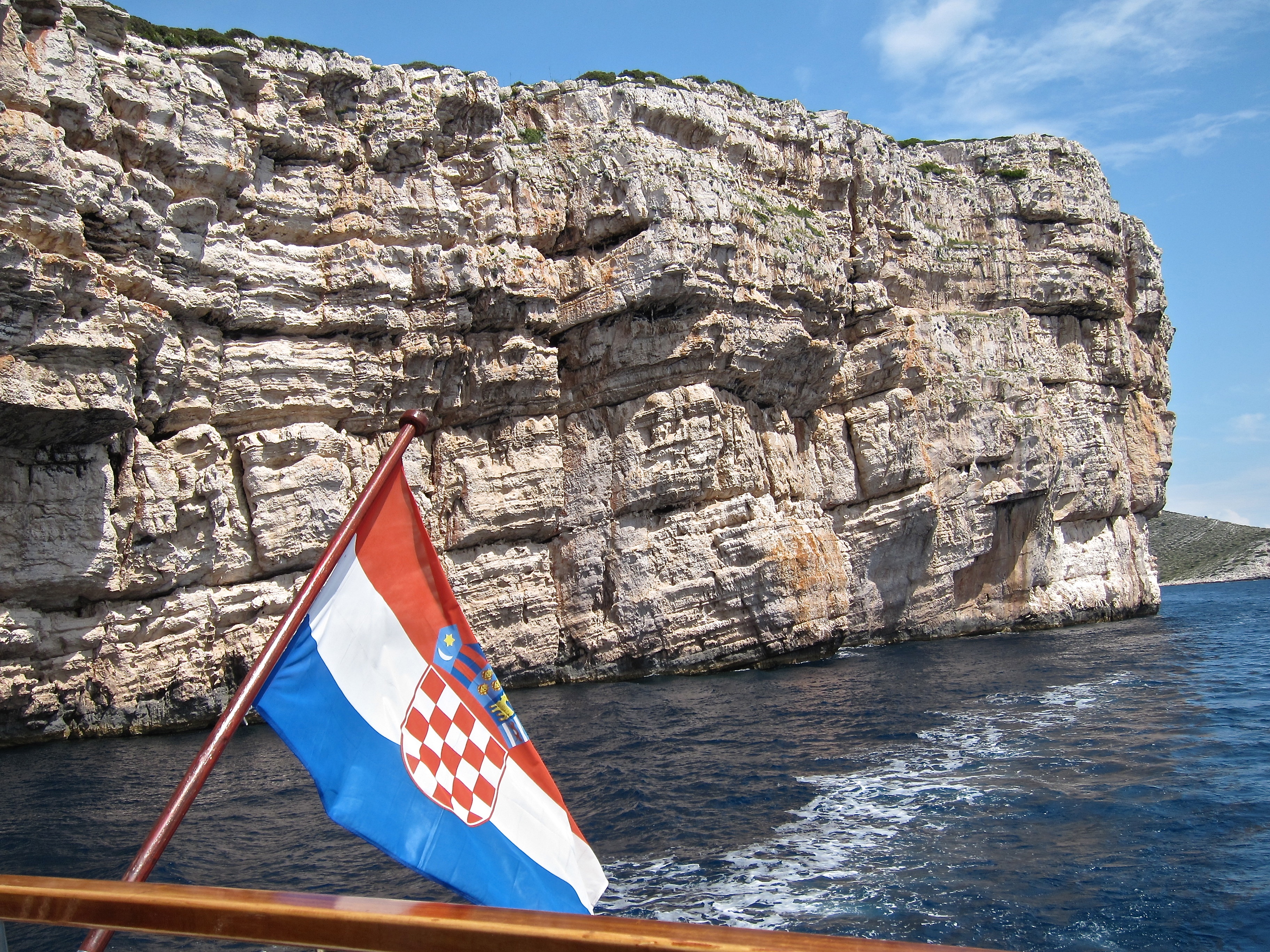 Croatia National Parks bike tour boat and flag