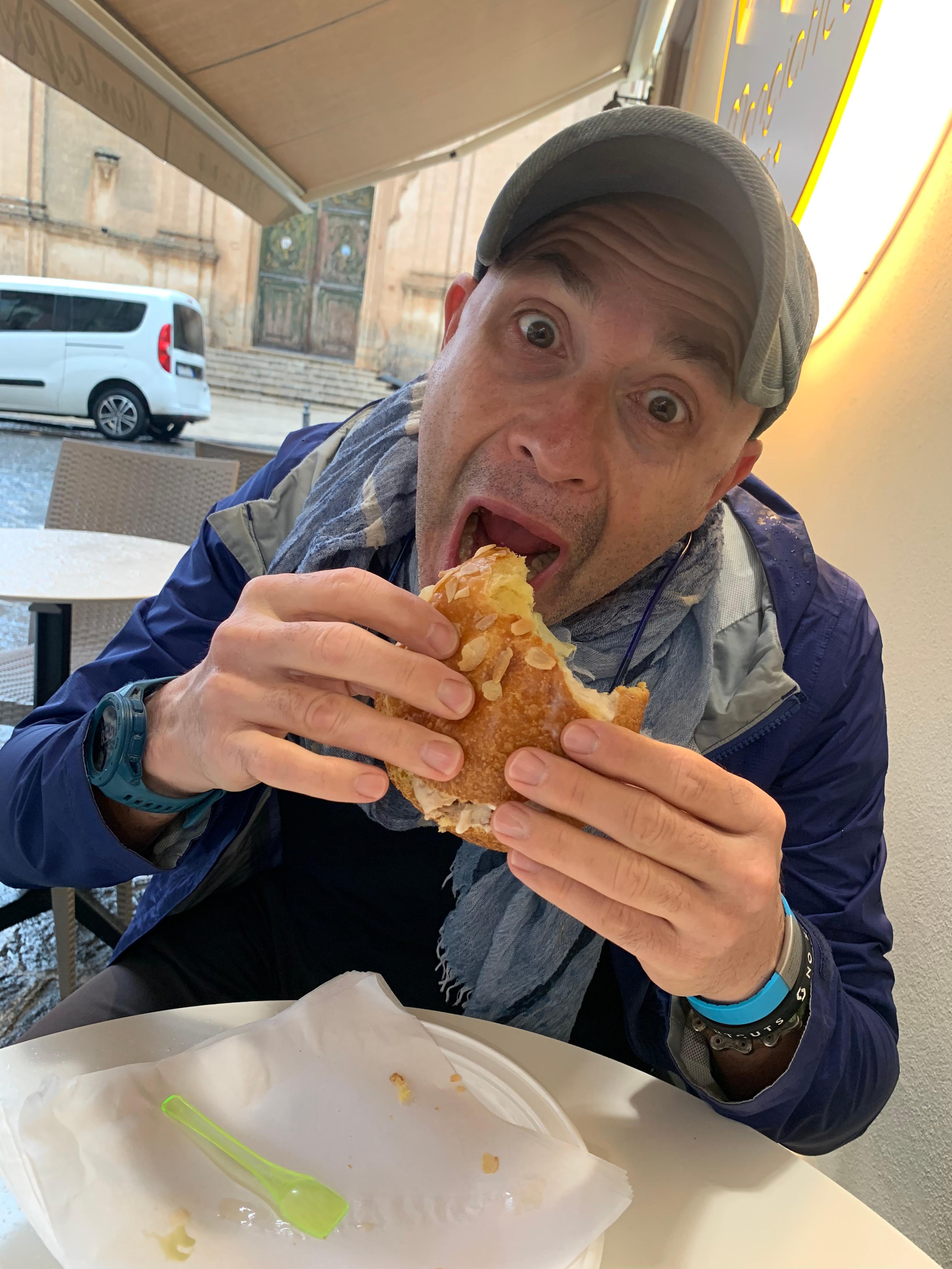 Sicily cycling tour man eating sandwich